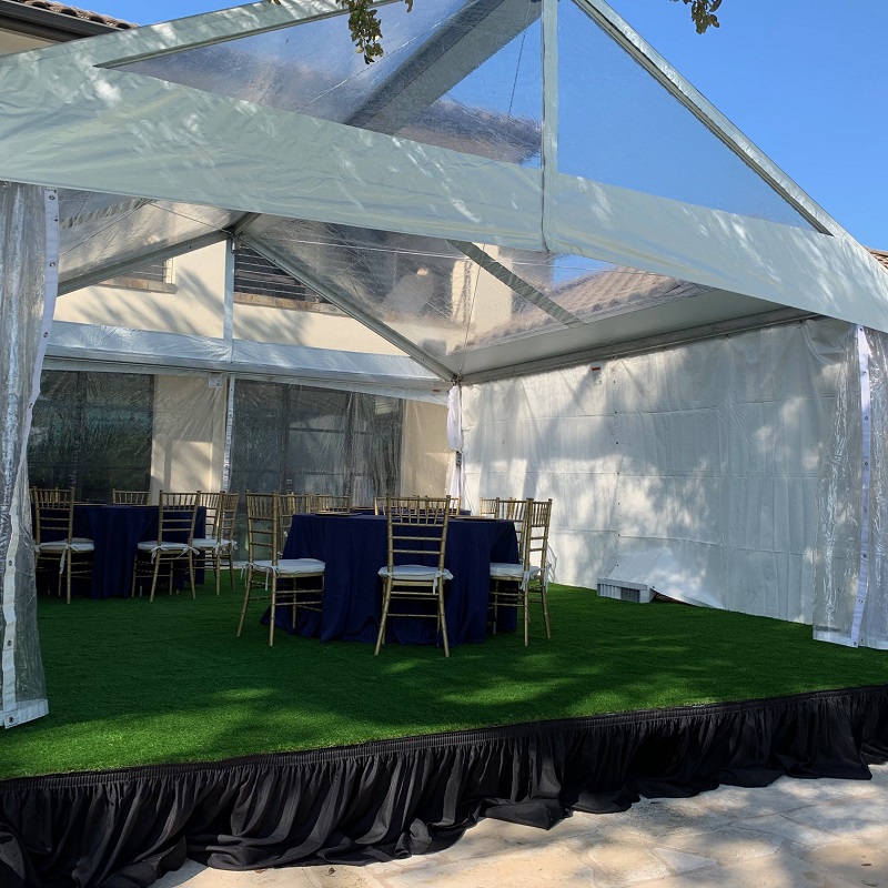 Clear Top Bandshell tent, White and Clear Sidewalls, Stage with Skirting and Astroturf, and Tent Heater