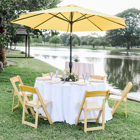 60in Umbrella Table with Yellow Umbrella, White Economy Linen, and Natural Wood Folding Chairs