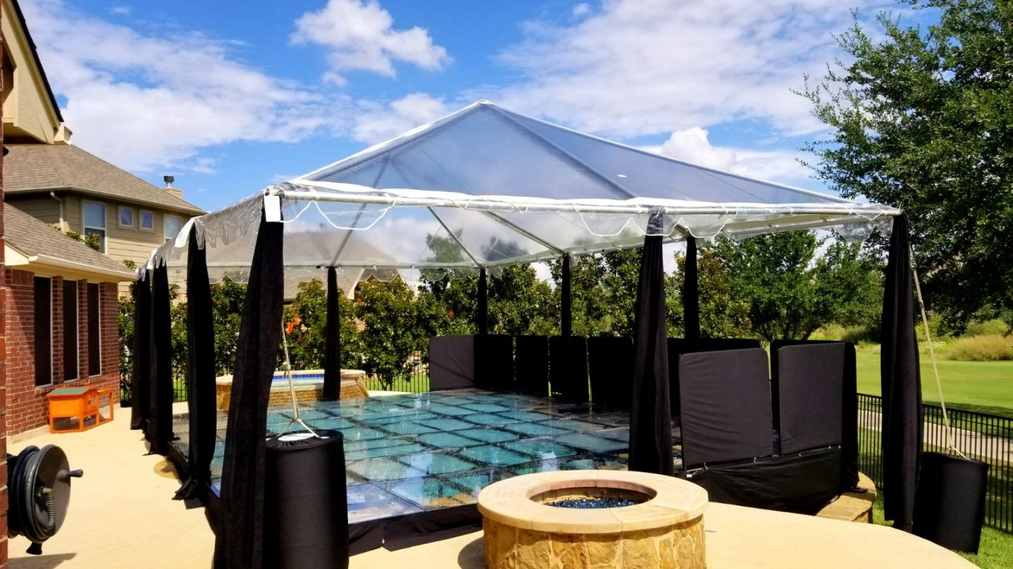 Tent with a Clear Stage Over a Pool