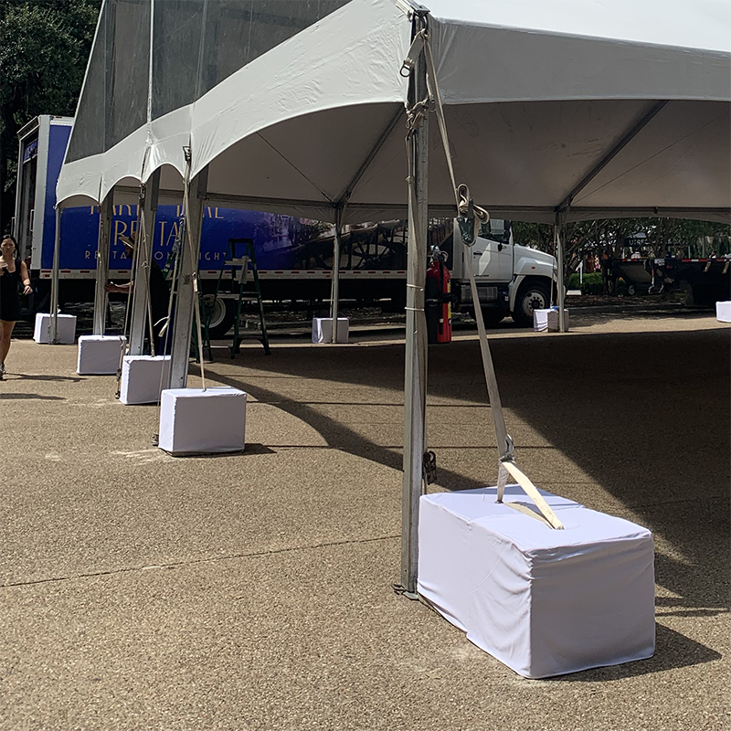 Tent Concrete Blocks with White Covers