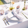 White Fresco Velvet Napkin, Clear Glass Beaded Charger, Linen Ivory Heirloom Dinner Plate, Capri Brushed Gold Flatware