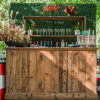 Rustic Bar + Boxwood Hedge + Wooden Plank Bar Back - Live Fire, Camp Mabry
